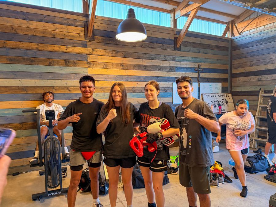 Club members posing with their gloves after training